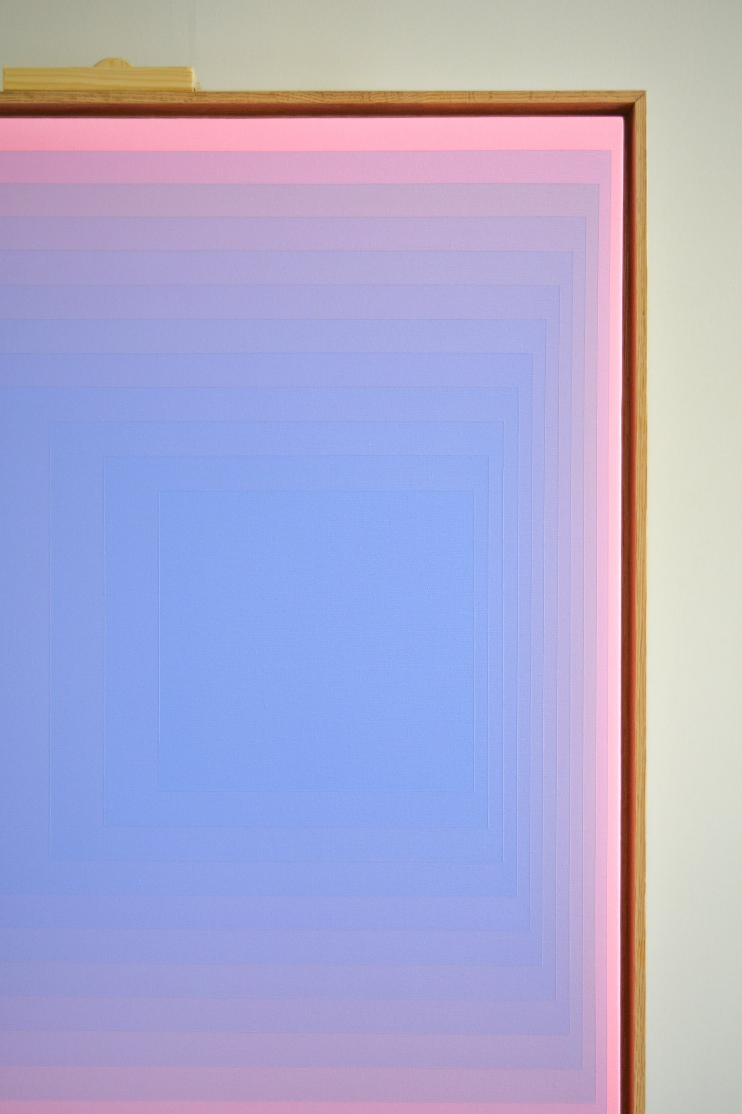 Abstract painting with concentric squares, transitioning from blue in the center to pink at the edges in a smooth gradient.