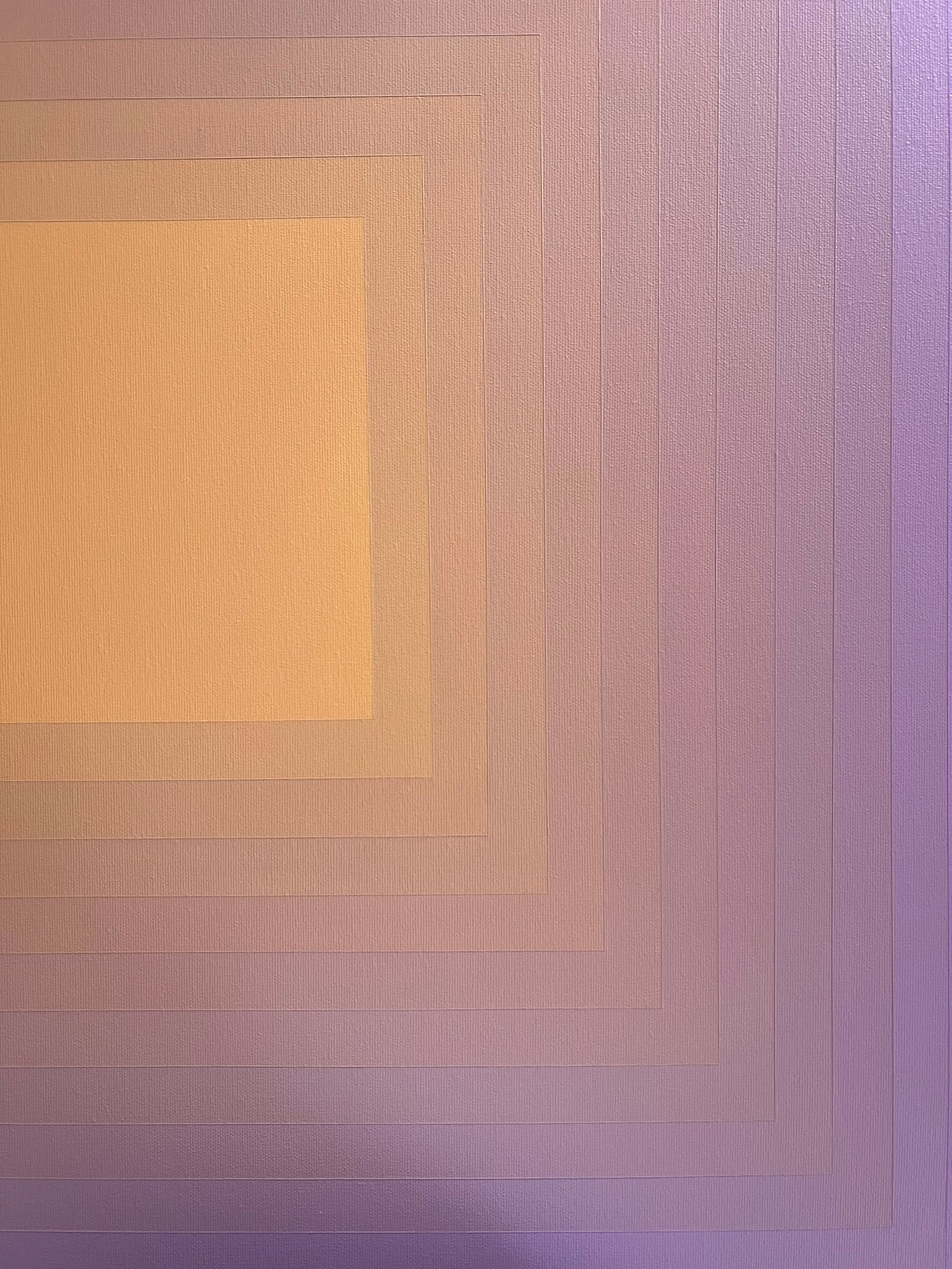 Abstract artwork with concentric squares transitioning from a peach center to lavender edges in a smooth gradient.